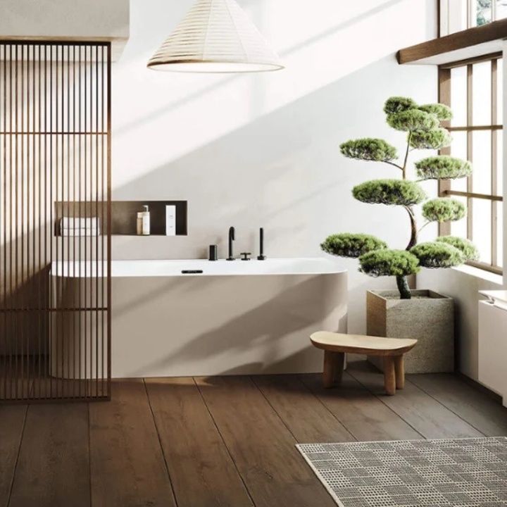 Lifestyle image of a wellness bathroom with single ended bathtub and niche